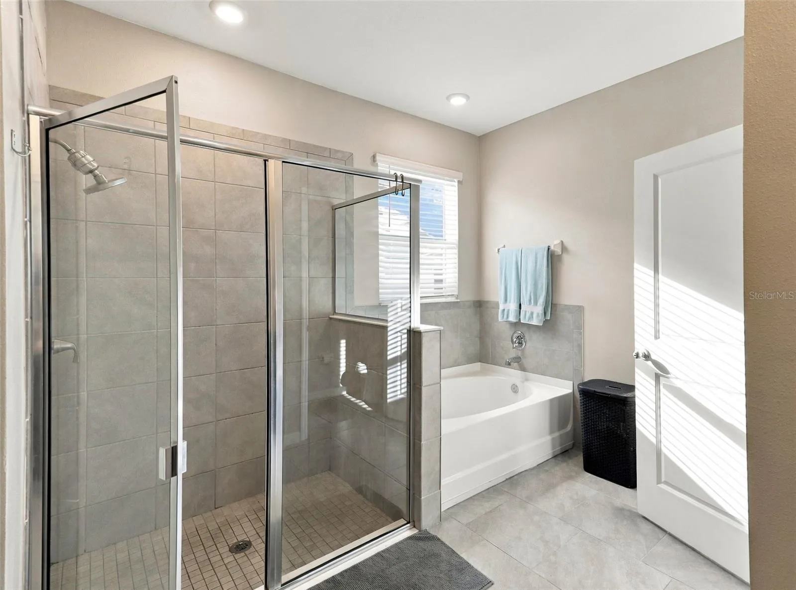 Primary Bathroom Featuring Glass-Enclosed Walk-In Shower