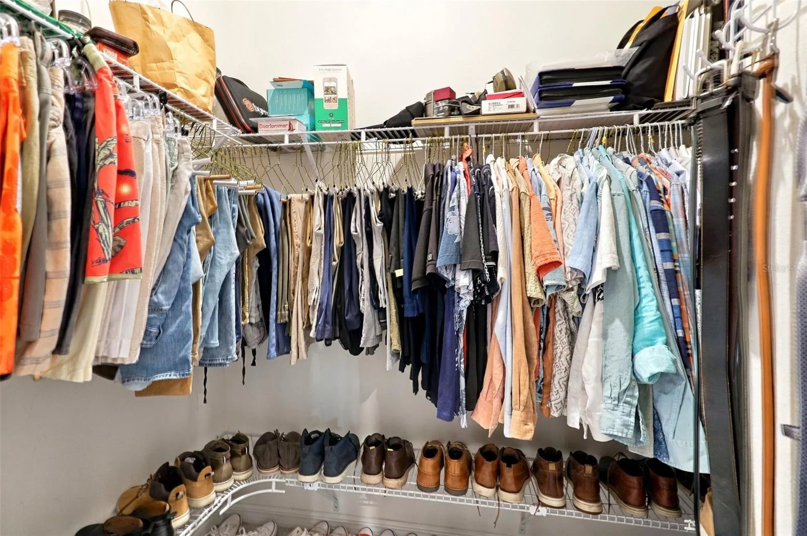 Spacious Walk-In Closet For Him with Built-In Shelving