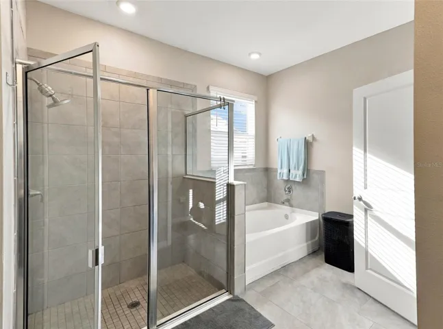 Primary Bathroom Featuring Glass-Enclosed Walk-In Shower
