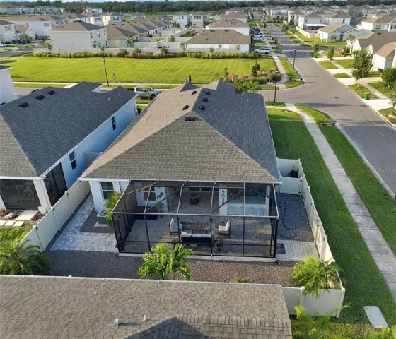 Rear View Showcasing the Home's Roofline and Outdoor Living Area
