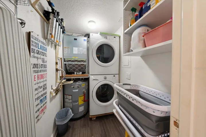 Inside laundry room with storage