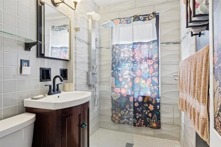 Stylish Bath with Vintage Tile Floors