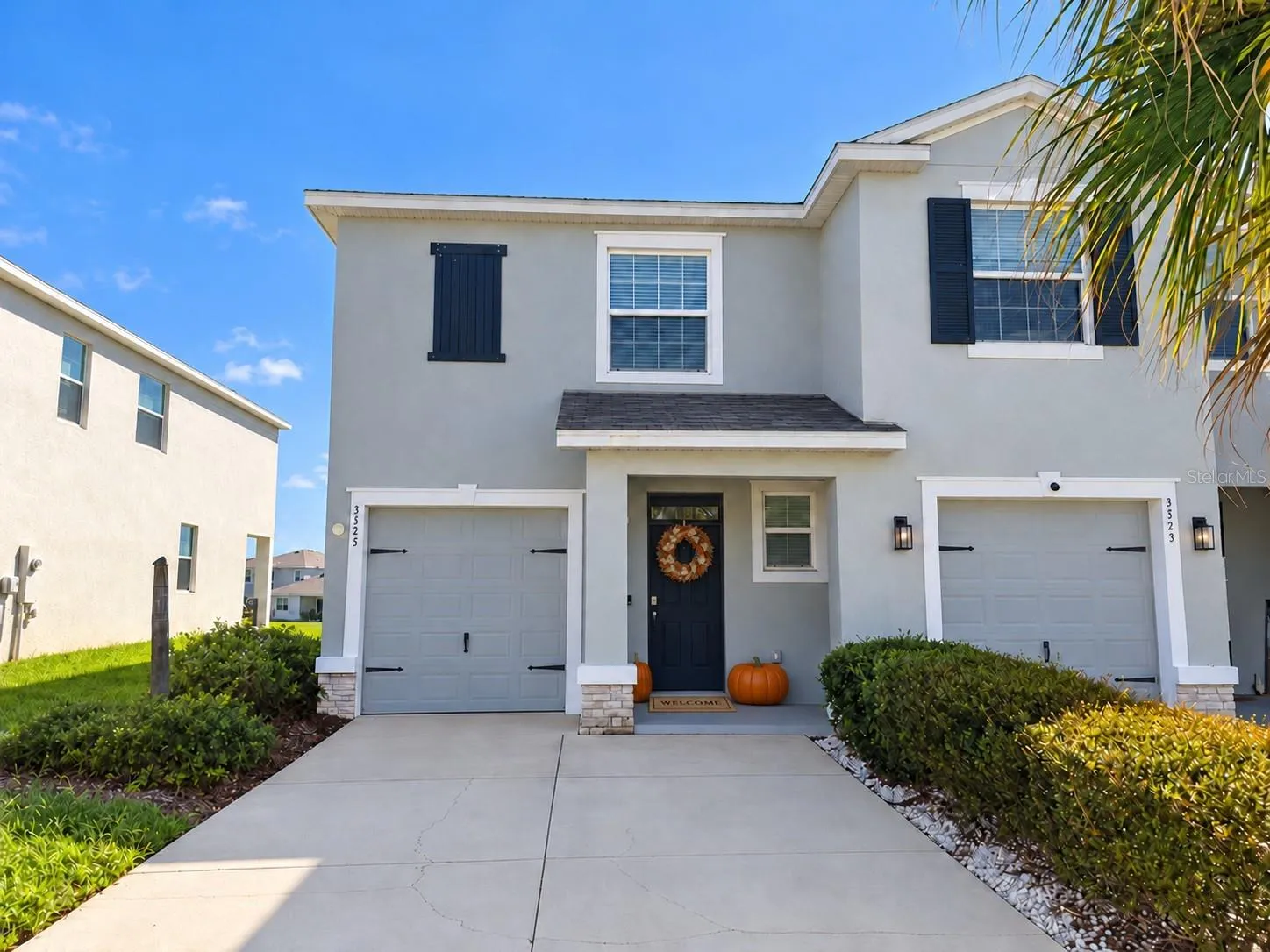 Front with oversized driveway