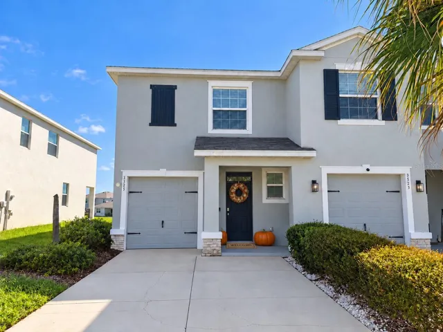 Front with oversized driveway
