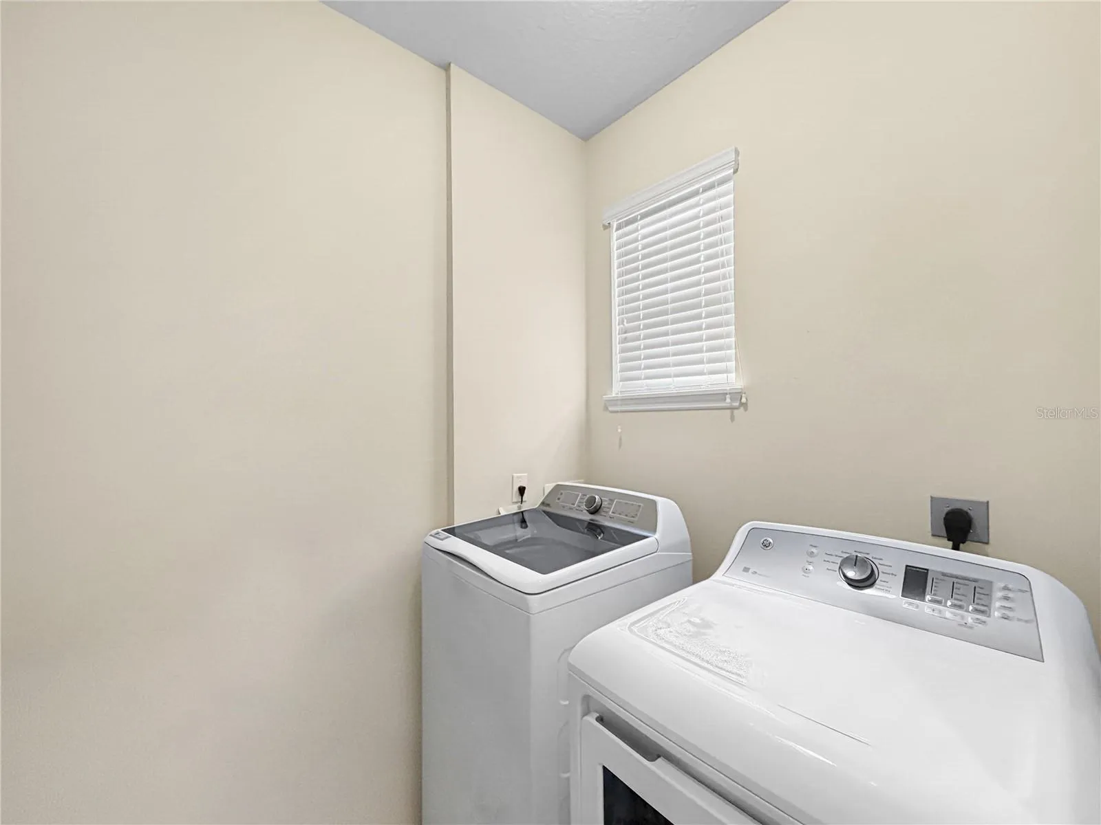 Indoor laundry room located downstairs