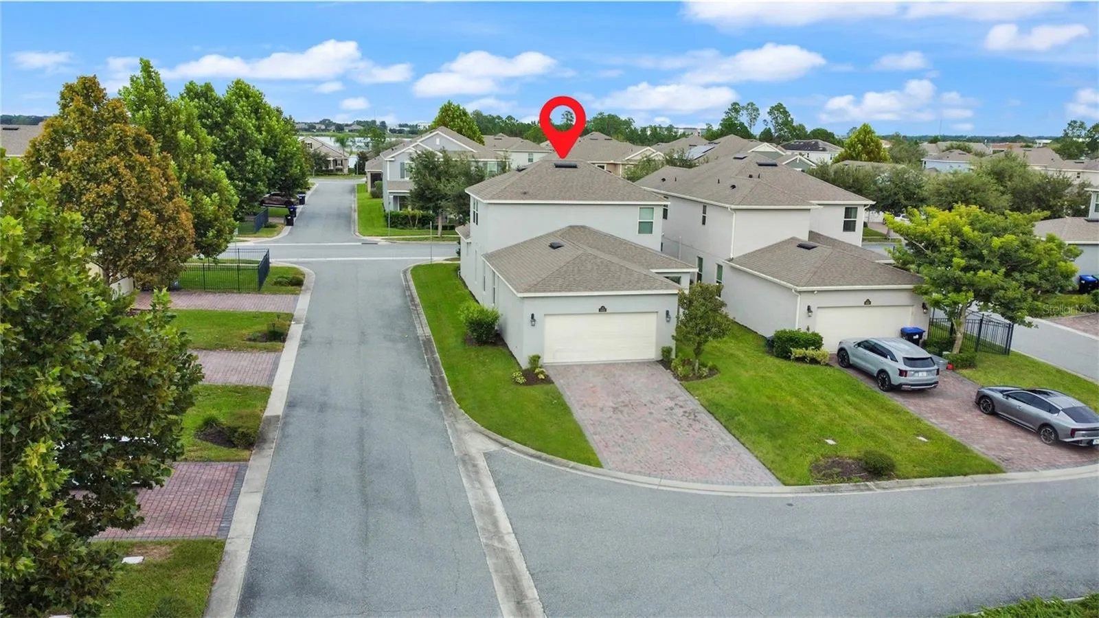 Garage & driveway located in the rear of the home.
