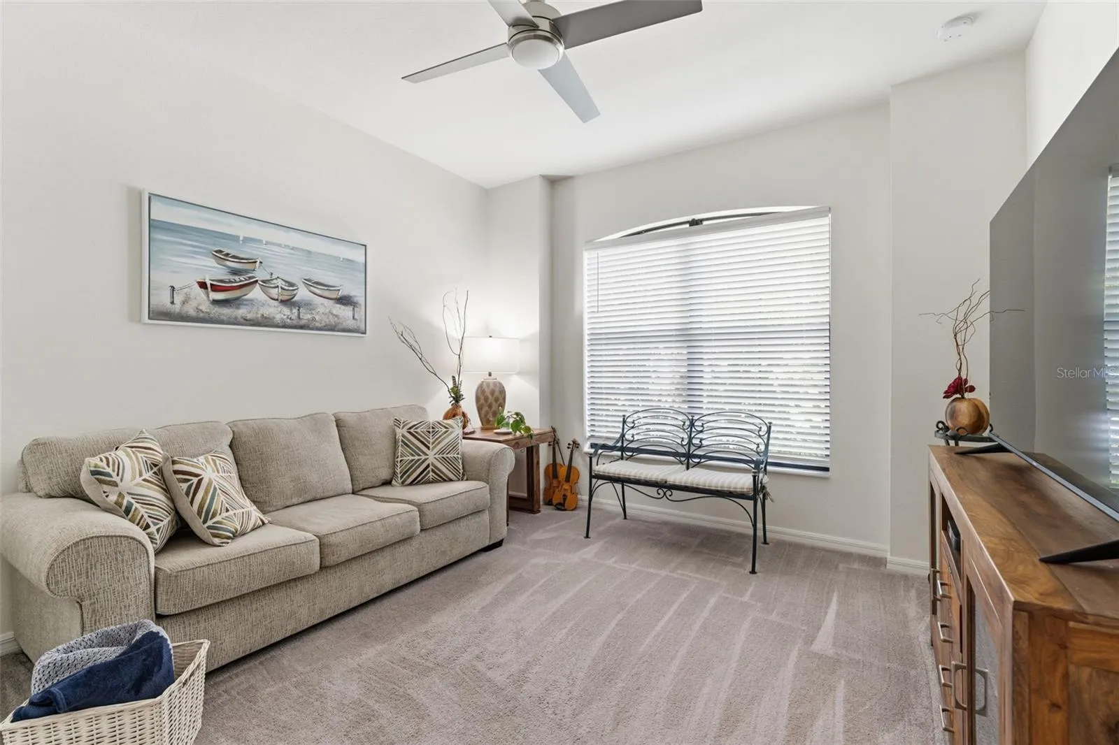 Bedroom 3 at the front of the house is being utilized as a TV room