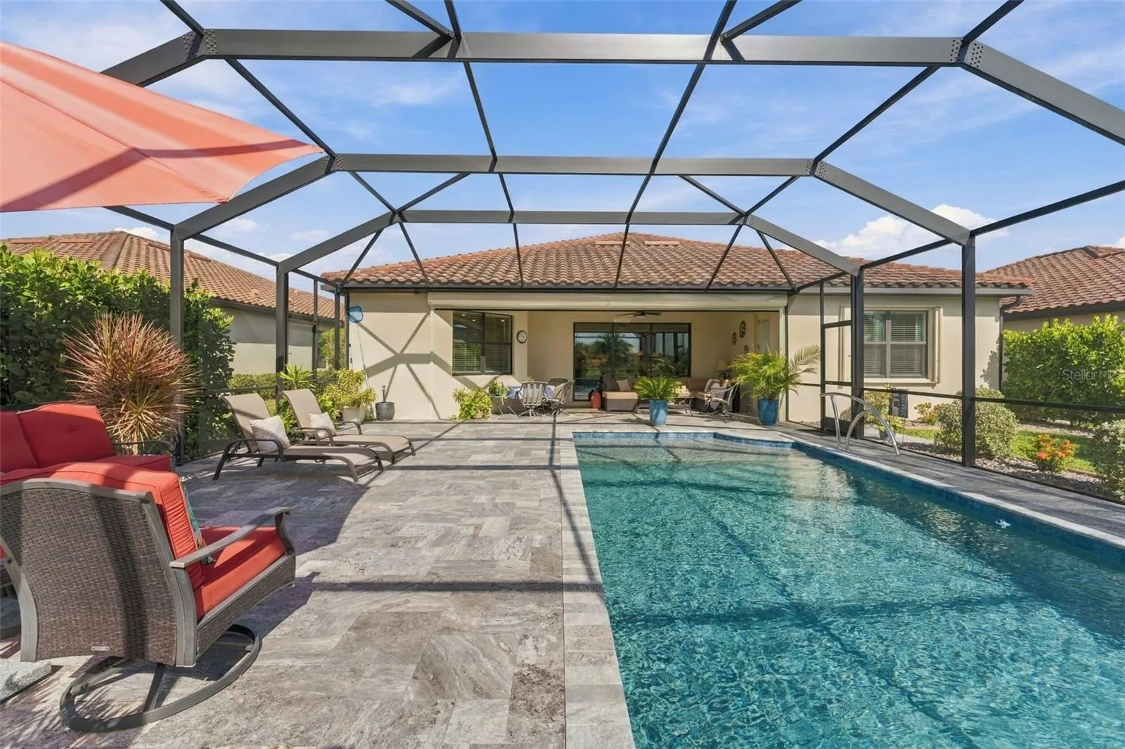 Dramatic 12.5 x 30 ft Pool  draws you to the covered Lanai