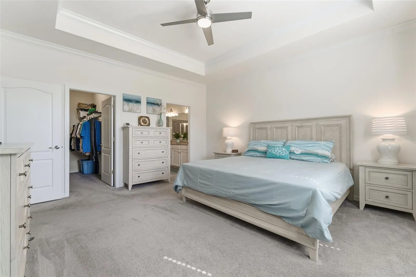 Primary bedroom with walk-in closet and en suite bathroom