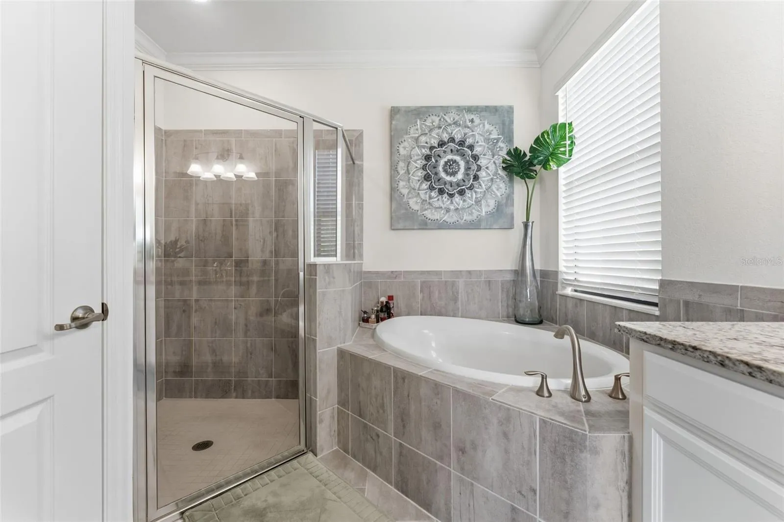 Separate shower stall with private water closet on left