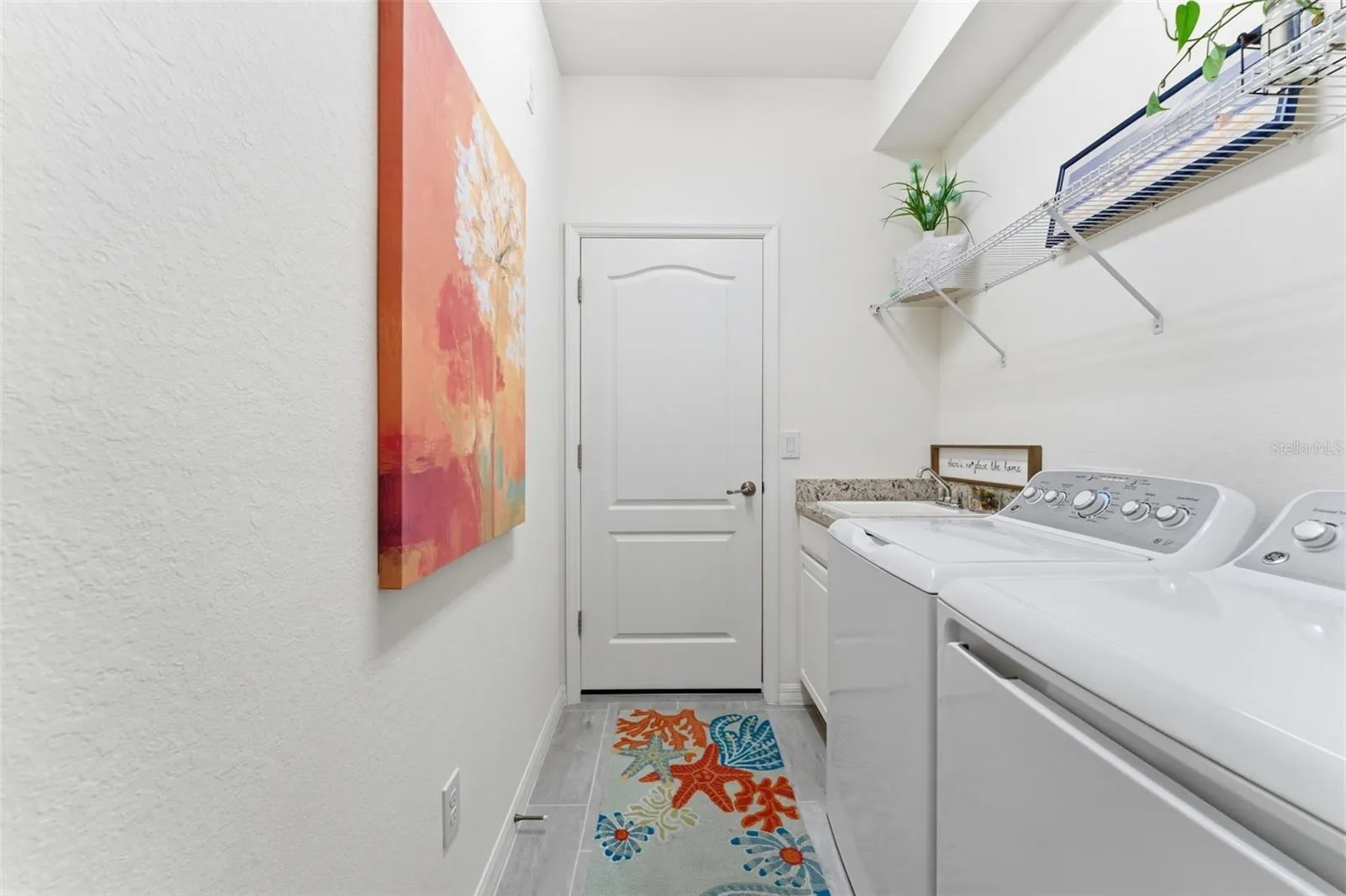 Laundry room with full size washer/dryer