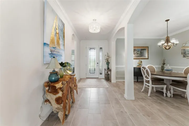 Formal dining room with chair rail and picture-frame wainscoting