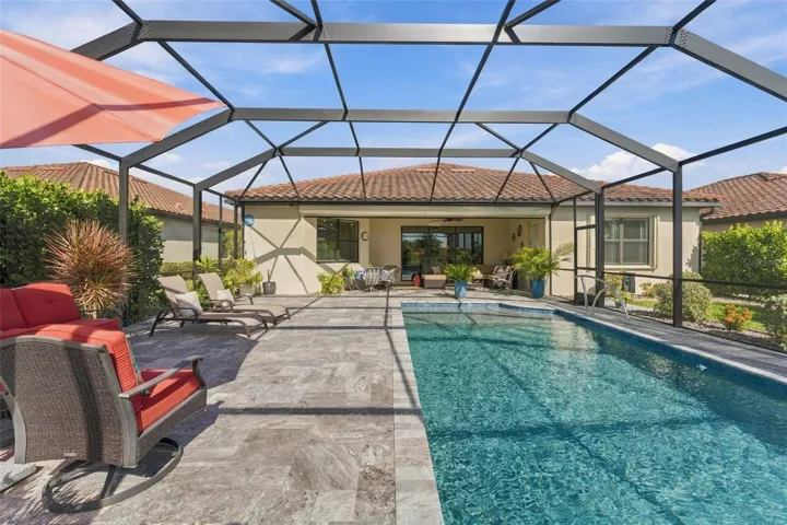 Dramatic 12.5 x 30 ft Pool  draws you to the covered Lanai