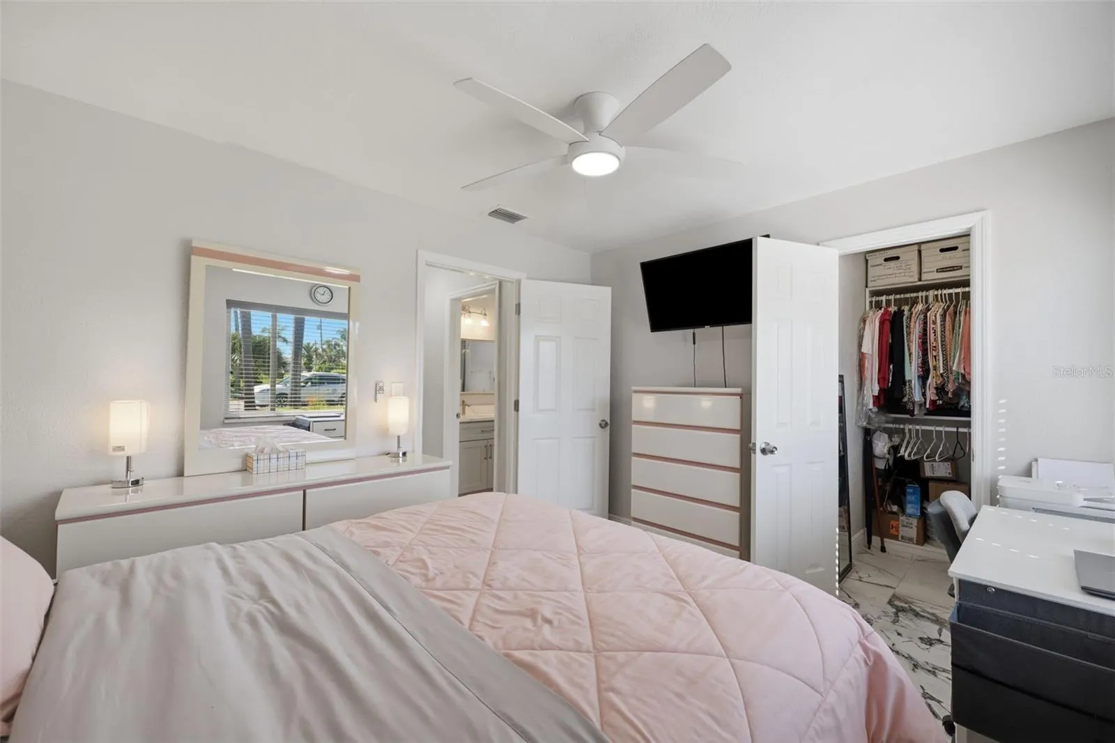 Guest bedroom with large custom closet