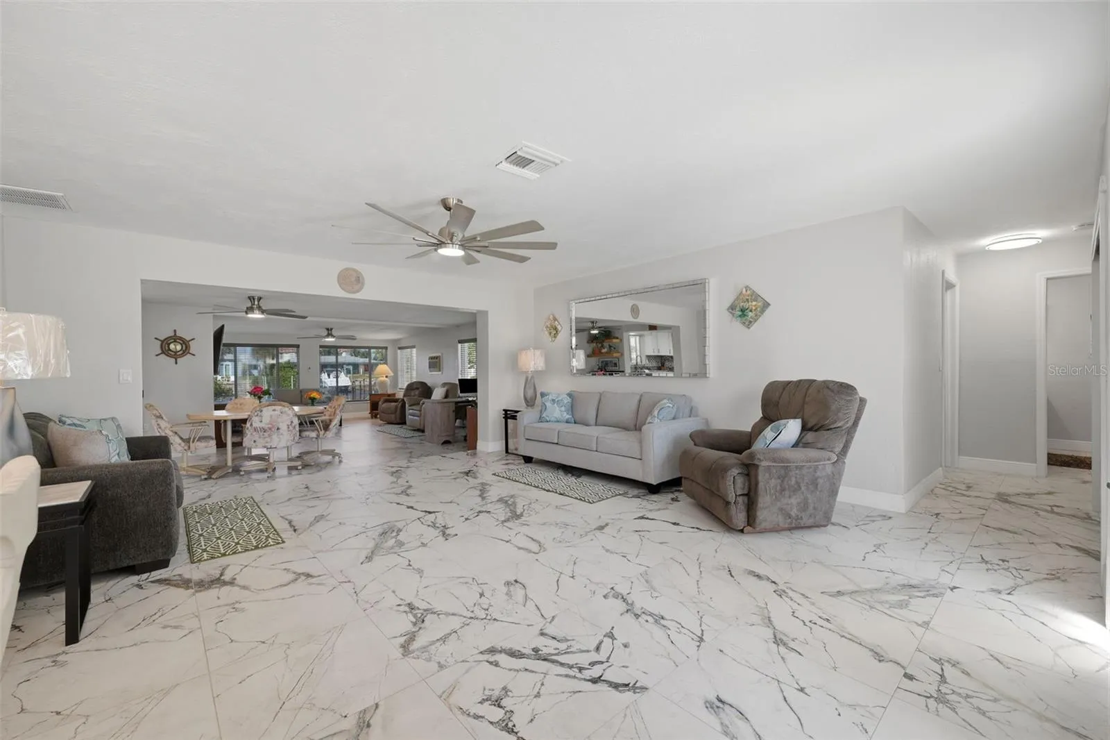 2 living areas | 2 dining areas - sunken family room.  Water view upon entering home