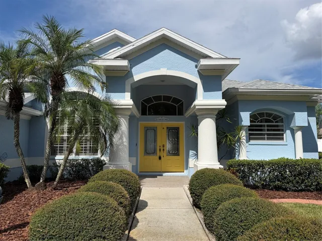 Columns and double door entry at front of home