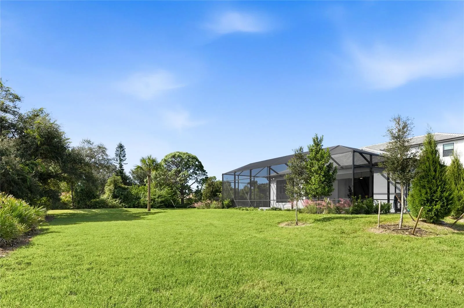 Rear of home is lush landscaping.