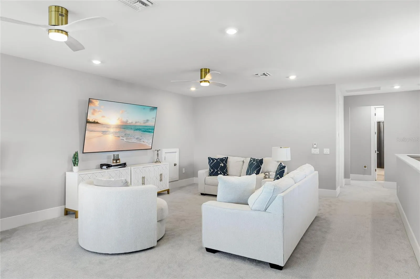 Light-filled bonus room featuring ample windows and transom windows, offering a versatile space ideal for a second TV room, home office, or additional gathering area—perfect for entertaining guests and enjoying quality time with family
