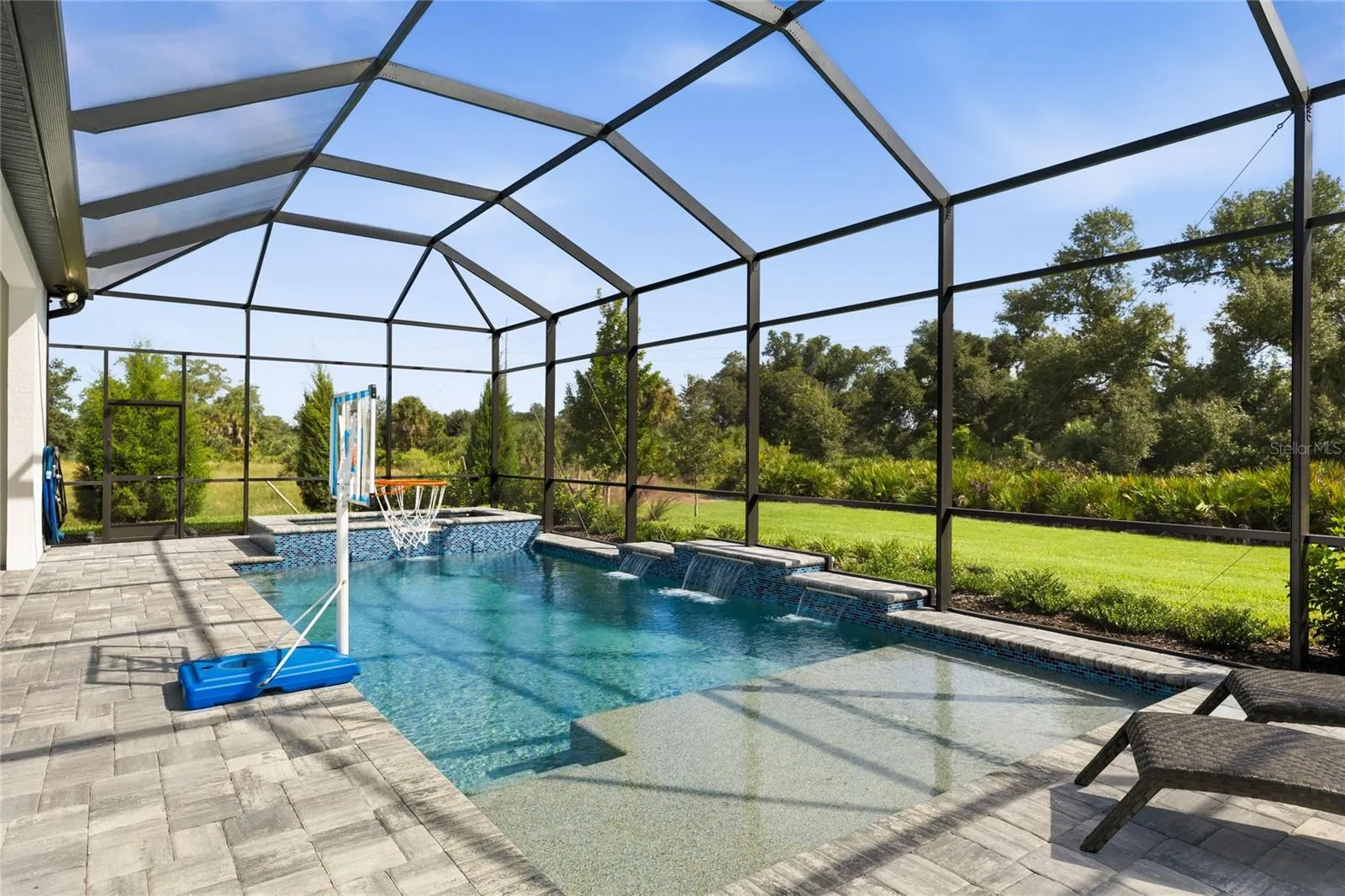 Custom Saltwater Pool with expansive spillover Spa, additional water features and Pool Shelf.