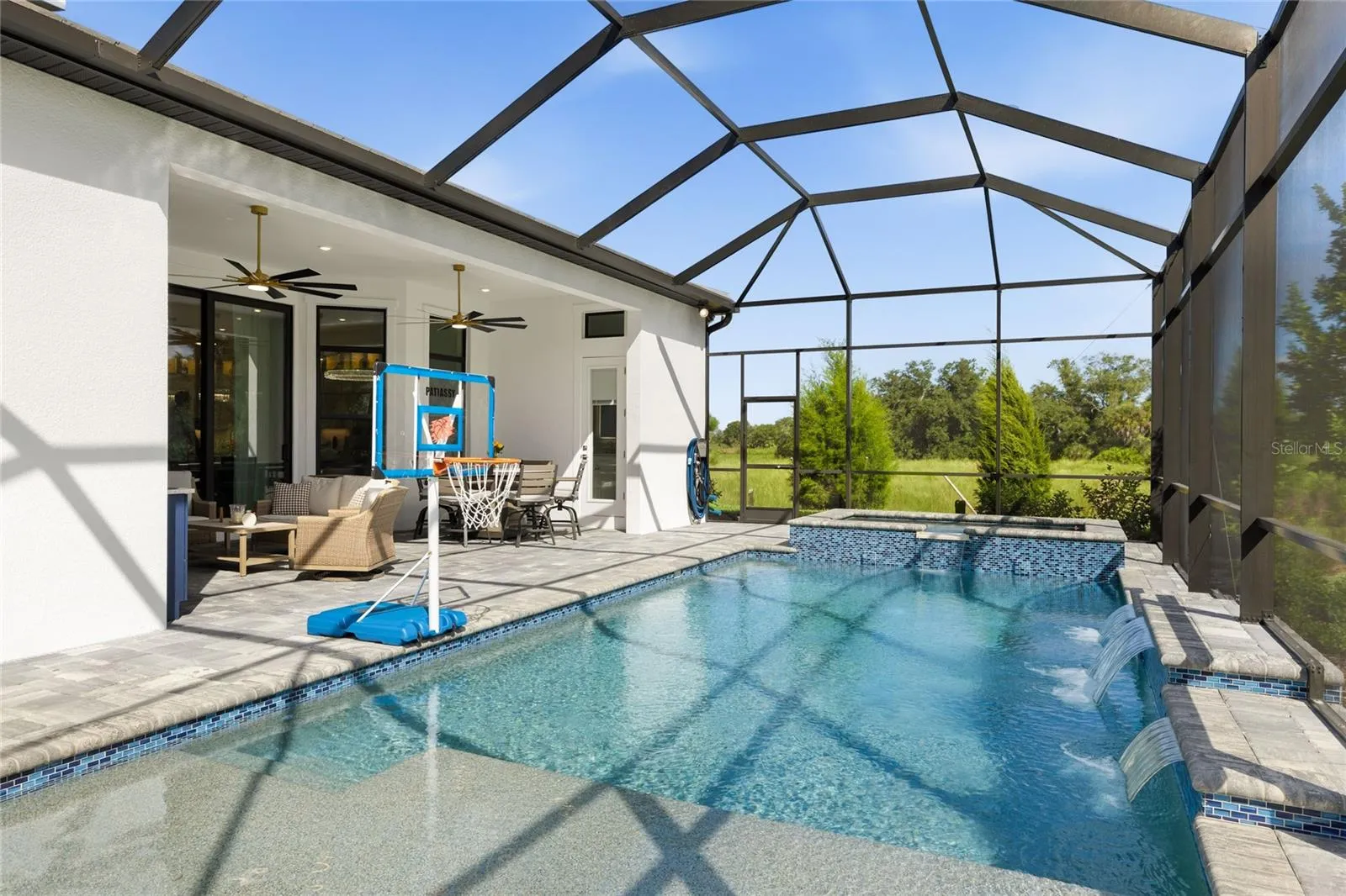 Custom Saltwater Pool with expansive spillover Spa, additional water features and Pool Shelf.