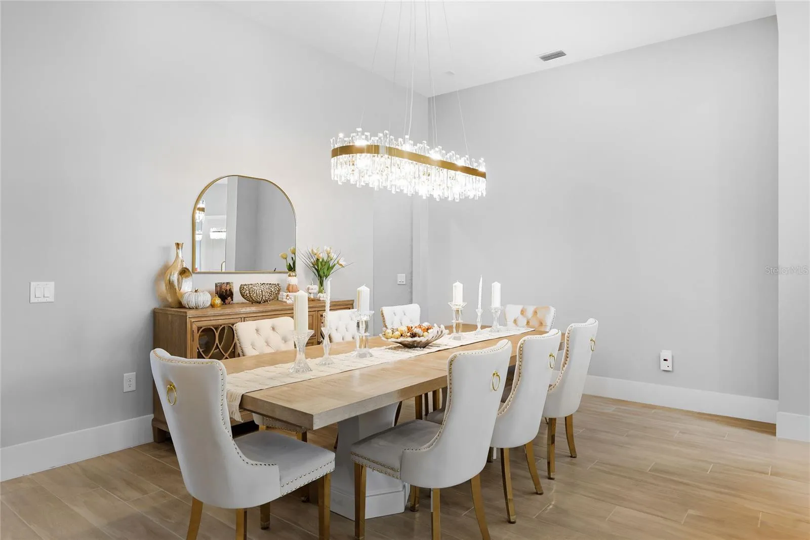 Spacious, elegant  Dining Room with beautiful fixtures.