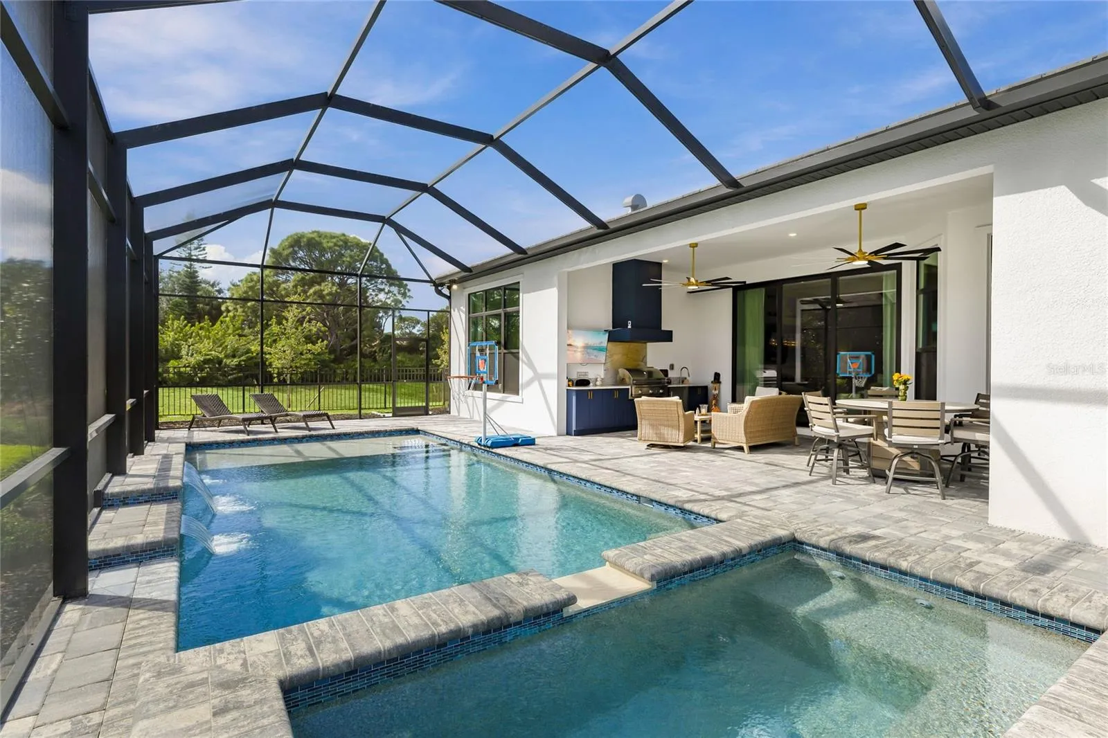 Custom Saltwater Pool with expansive spillover Spa, additional water features and Pool Shelf.