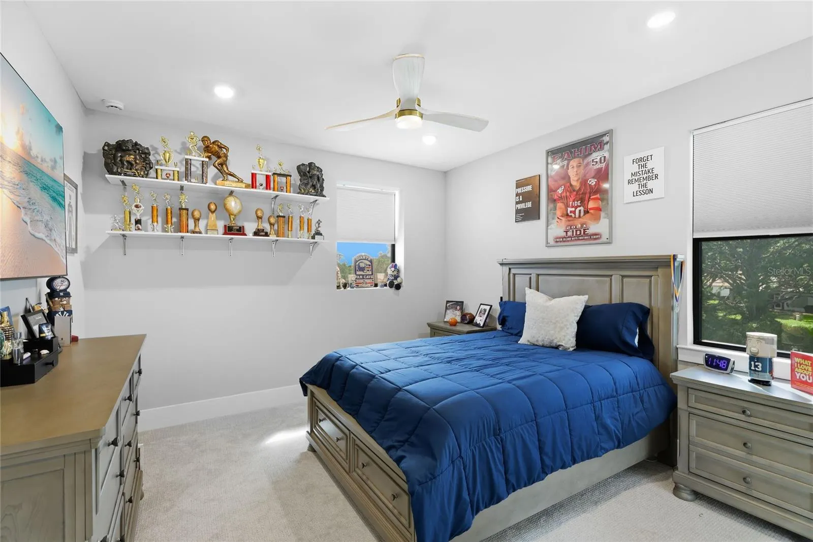 Bedroom 5 with ceiling fan and built in closet. Great water view over-looking the side of the home and creek.