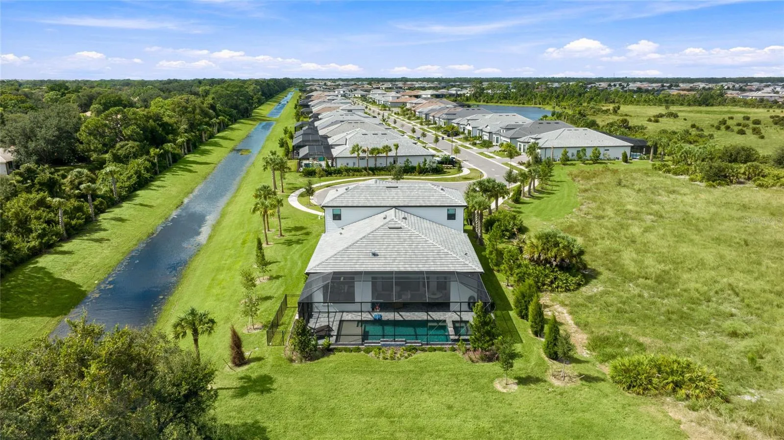 Rear Ariel view of the homehighlighting it sole residence on this cul-de-sac with preserve view and side water view.