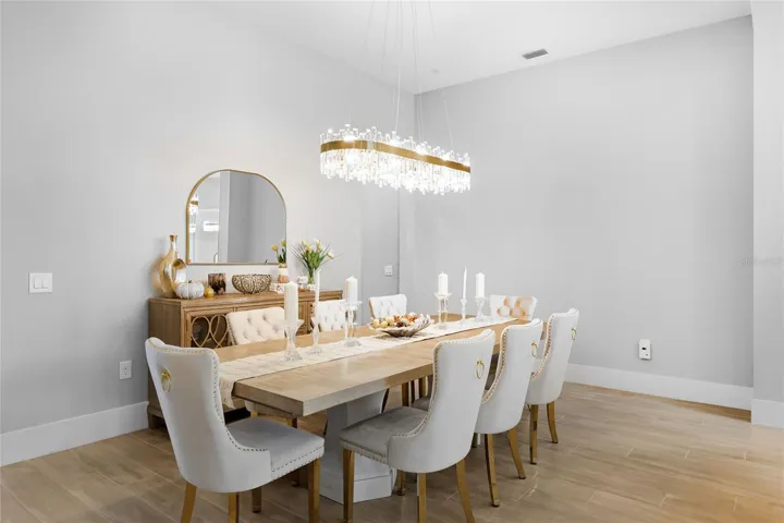 Spacious, elegant  Dining Room with beautiful fixtures.