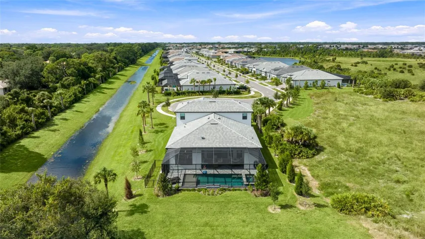 Rear Ariel view of the homehighlighting it sole residence on this cul-de-sac with preserve view and side water view.