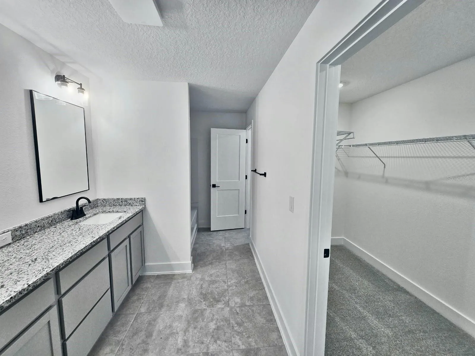 Primary bathroom and walk-in closet