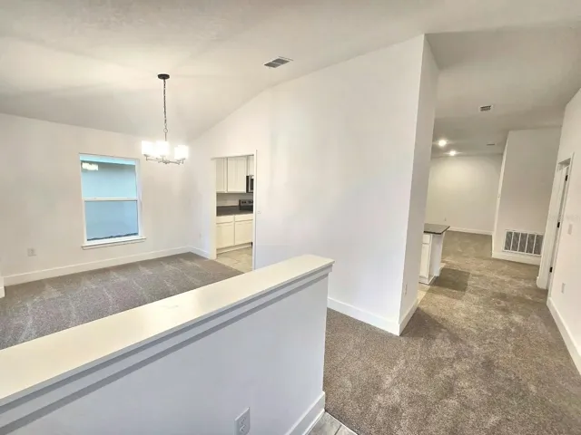 Foyer view to dining room and hall