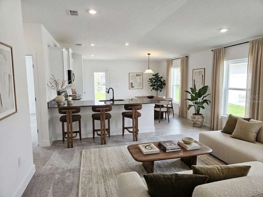 Great room and kitchen - virtually staged
