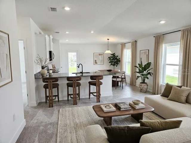 Great room and kitchen - virtually staged