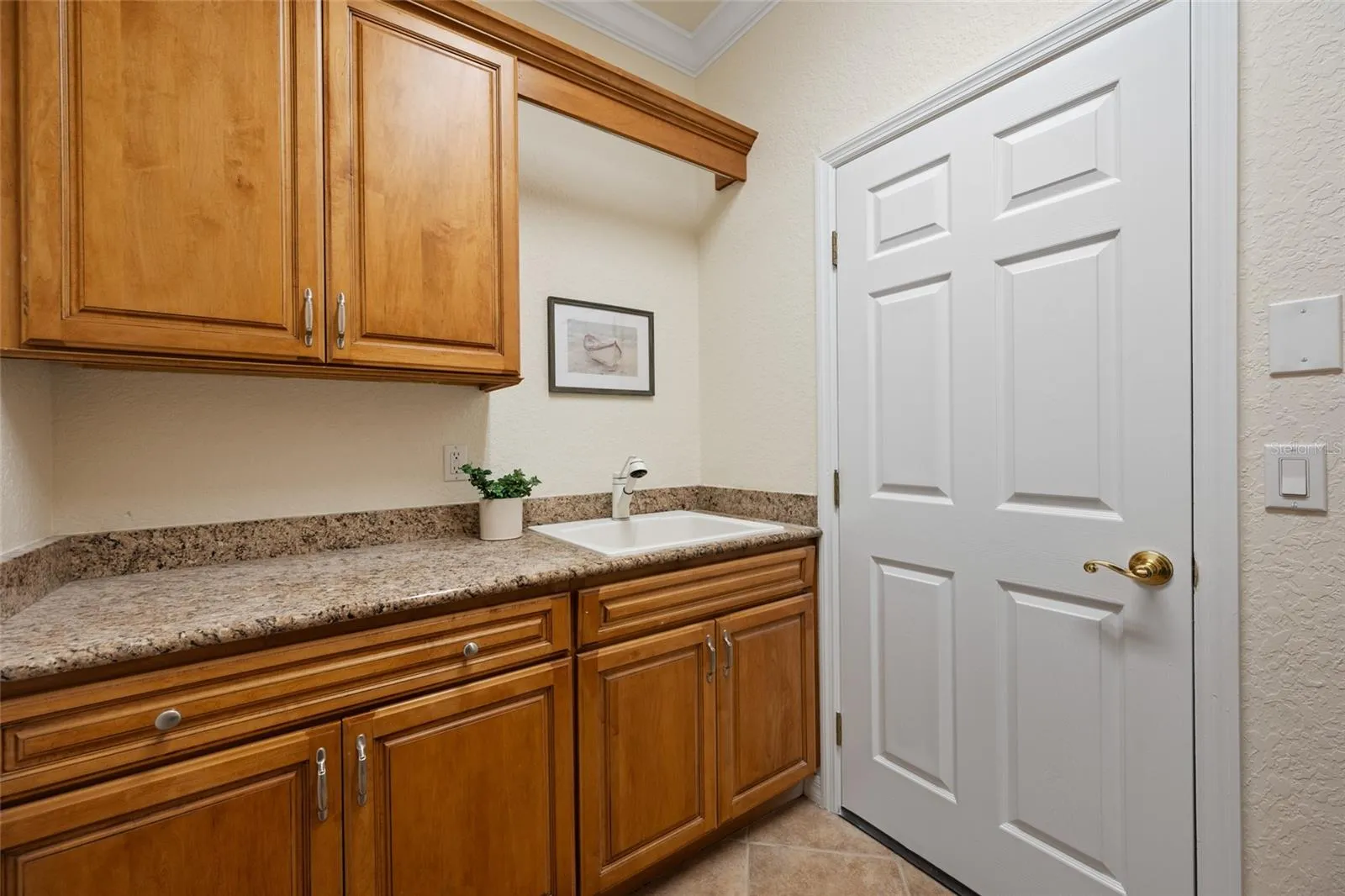 Laundry inc. Wet Sink, Cabinetry & Folding Area!