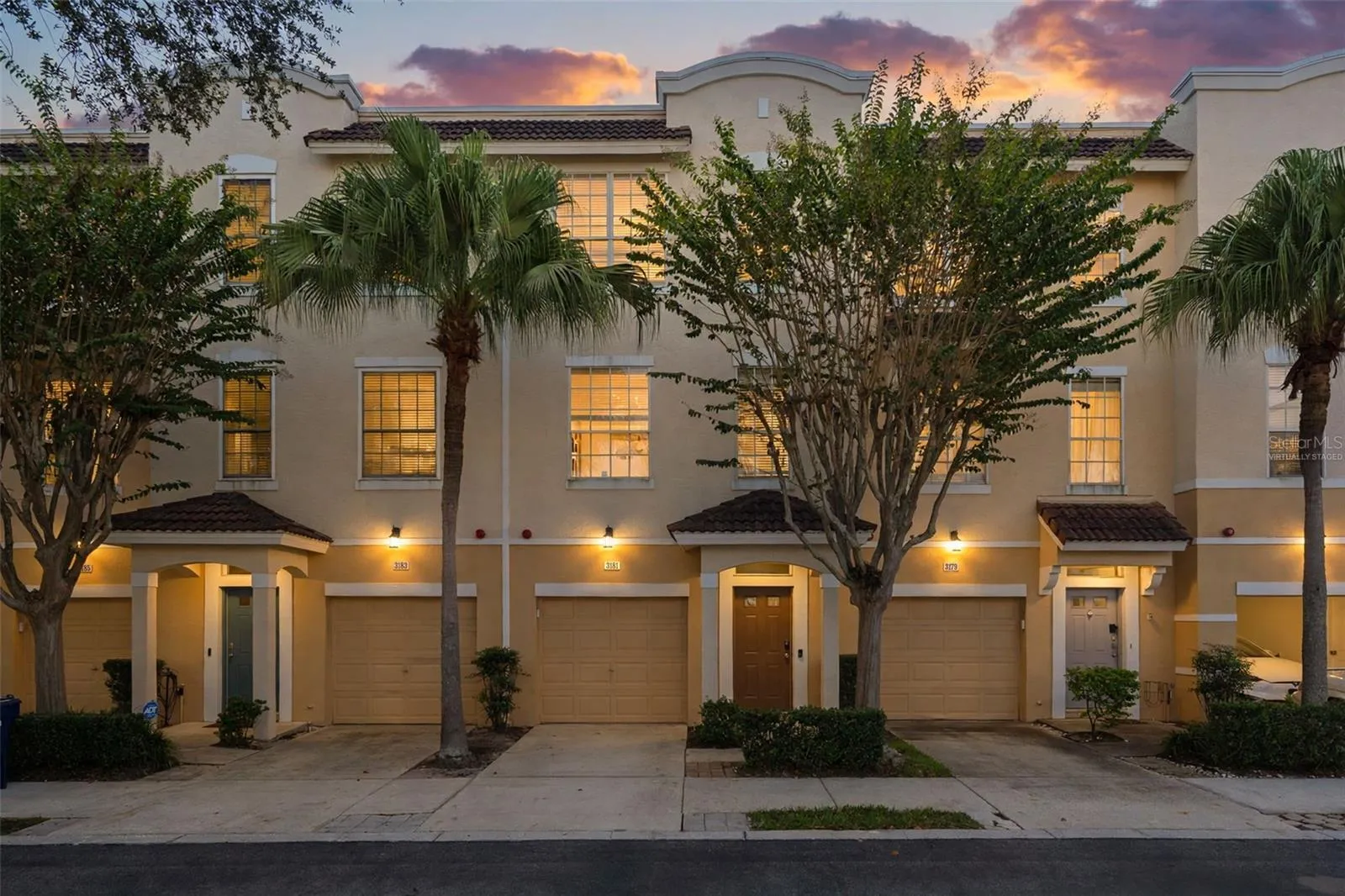 Front exterior - virtually staged twilight (digitally altered sky and lighting)