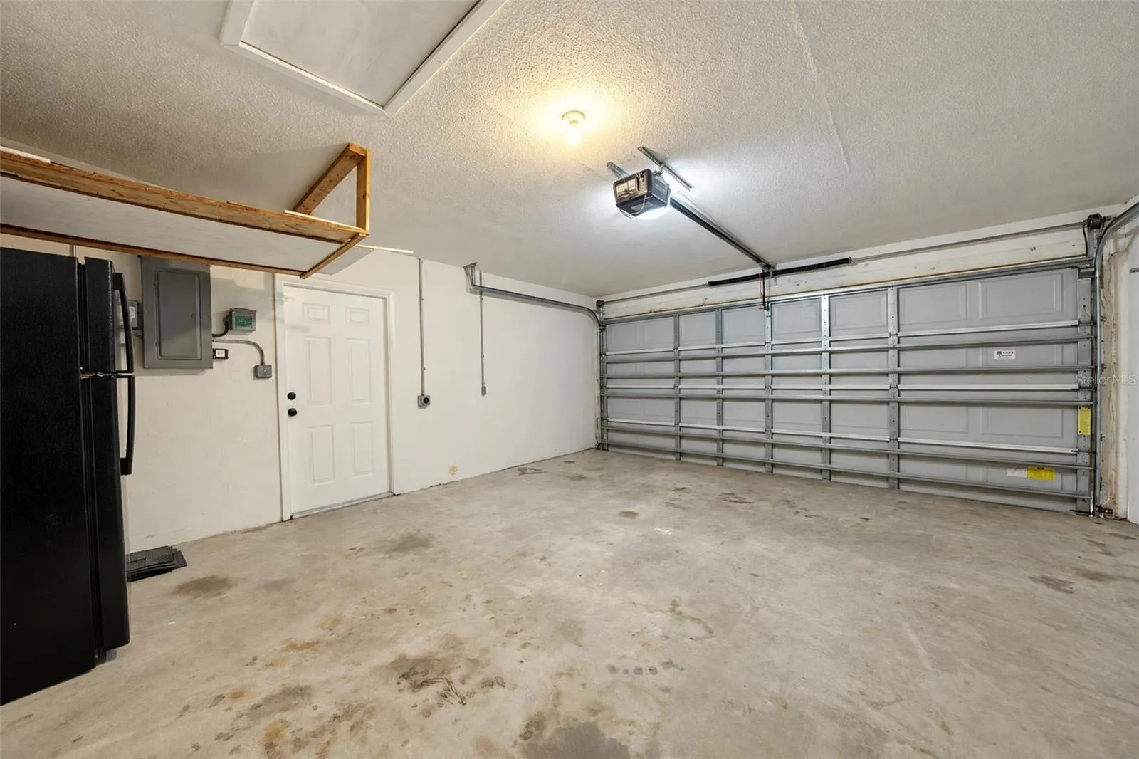 Garage with refrigerator