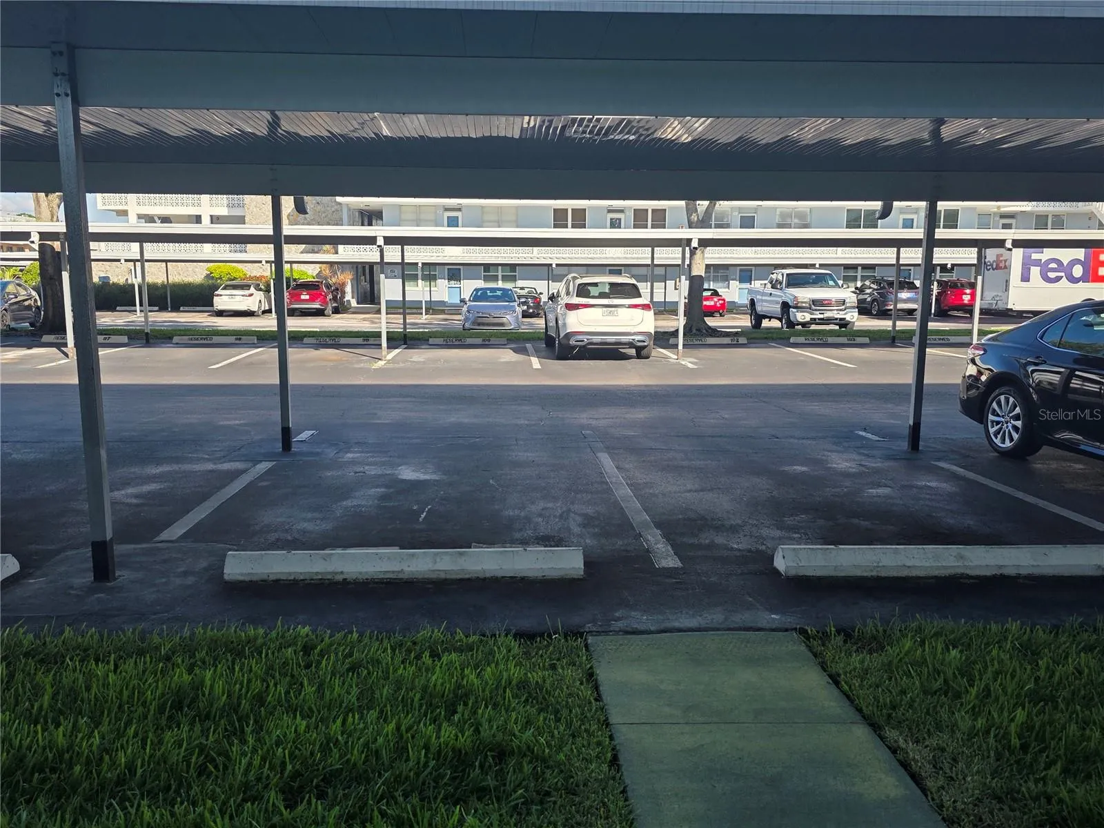 carport is directly in front of condo, just a few steps