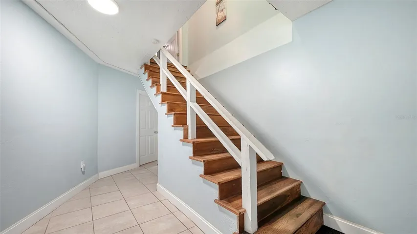 Unit A, entry hallway and stairs to Unit A.