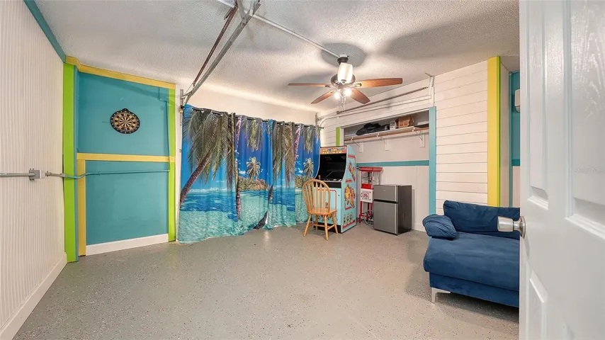 Ground floor under Unit B, converted garage to game or rec room/storage space.
