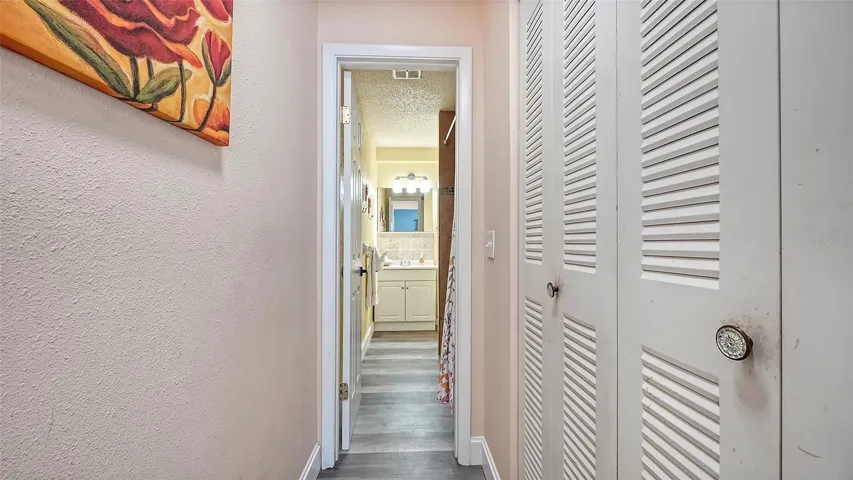 Unit B, hallway from bedroom to bathroom.