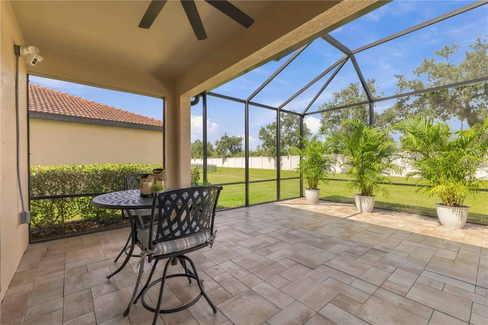 Extended, pavered, screened Lanai