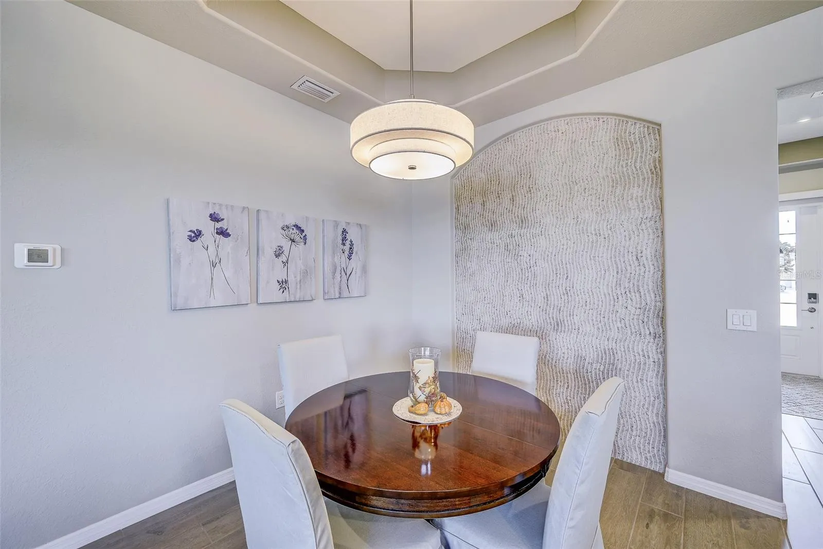 Dining area with custom tile feature wall