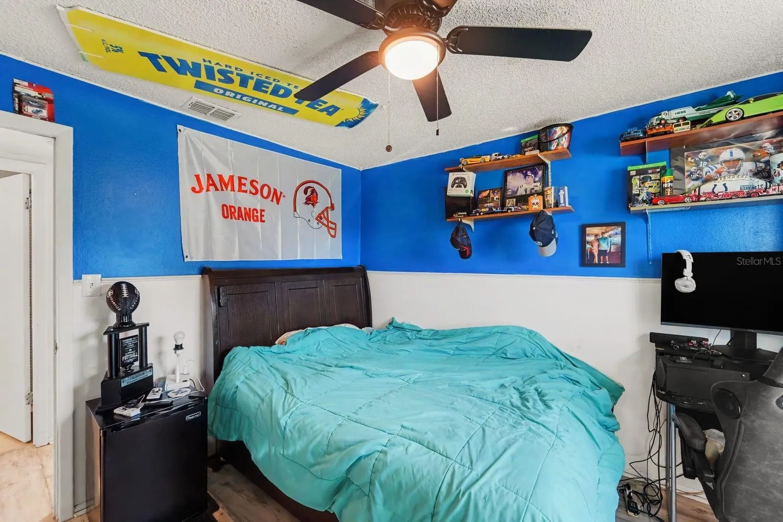 Guest Bedroom with Blue & White Color Scheme, Ceiling Fan & Entertainment Setup