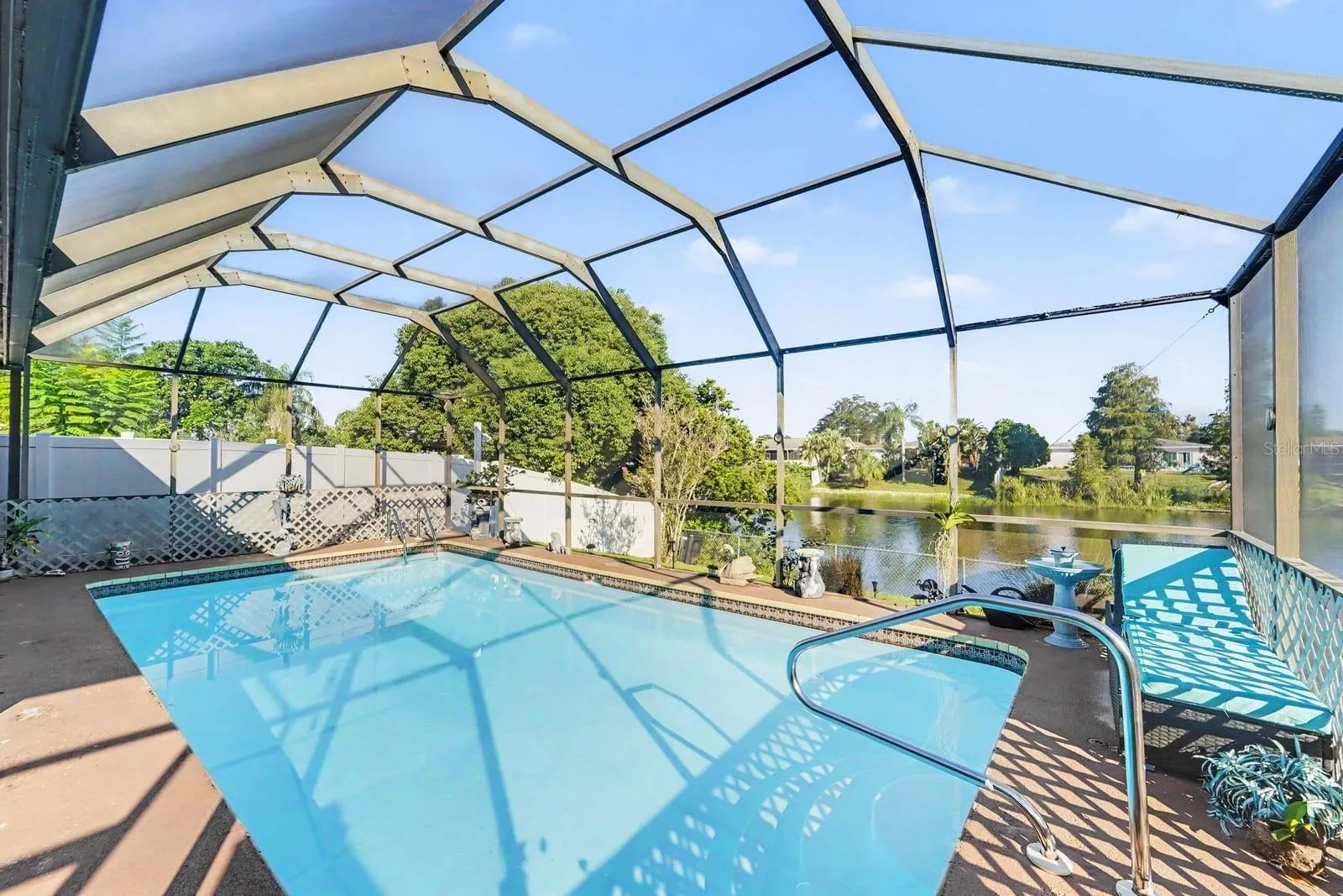Resort-Style Screened Pool with Arched Enclosure & Waterfront Views