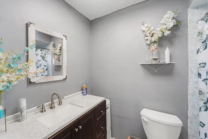 Spa-Like Half Bath With Marble Vanity, Wallpaper & Elegant Finishes