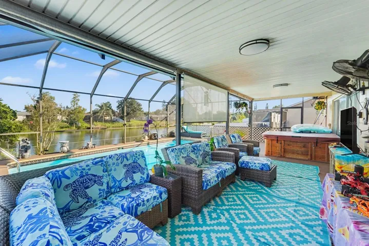 Expansive Pool Enclosure with Hot Tub, Lounge Area & Waterfront Views