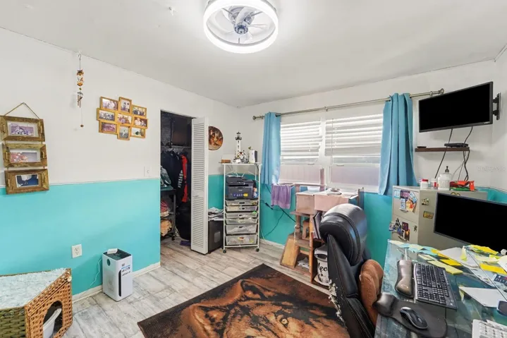 Multi-Purpose Office Room with Built-In Shelving, Workspace & Storage Solutions