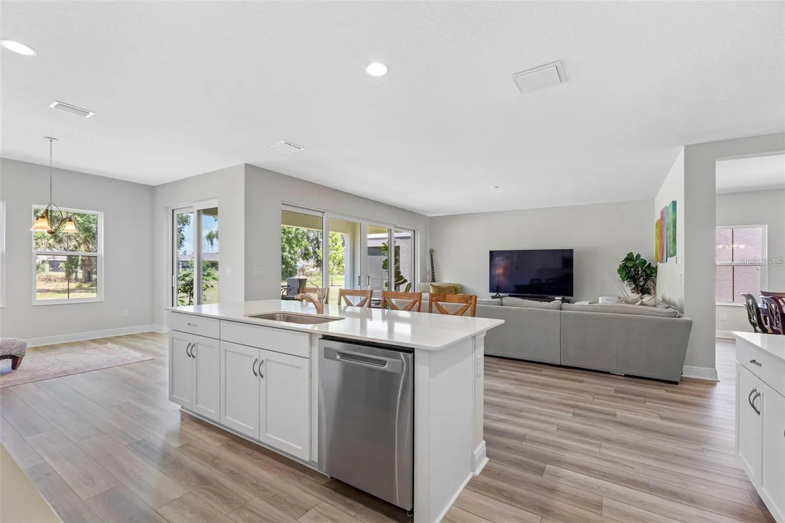 Large island with storage, opening to the cafe and backyard