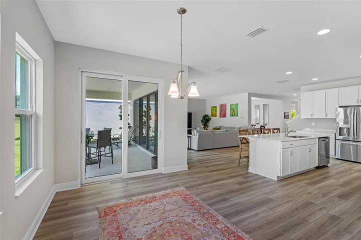 Sunlit cafe with sliding glass doors to the lanai